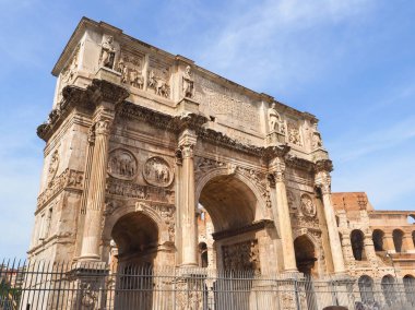 Famous Arch of Constantine or Arco di Costantino and part of Colosseum to right. High Roman structure, ornate triumphal arch, victory over Maxentius at Battle of Milvian Bridge, made up of three decorated arches. clipart