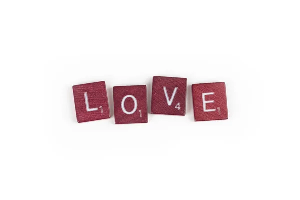 Wooden game tiles, love