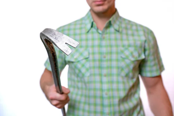 A man holds a nail clipper in his hand, close up, selective focus — Stock Photo, Image