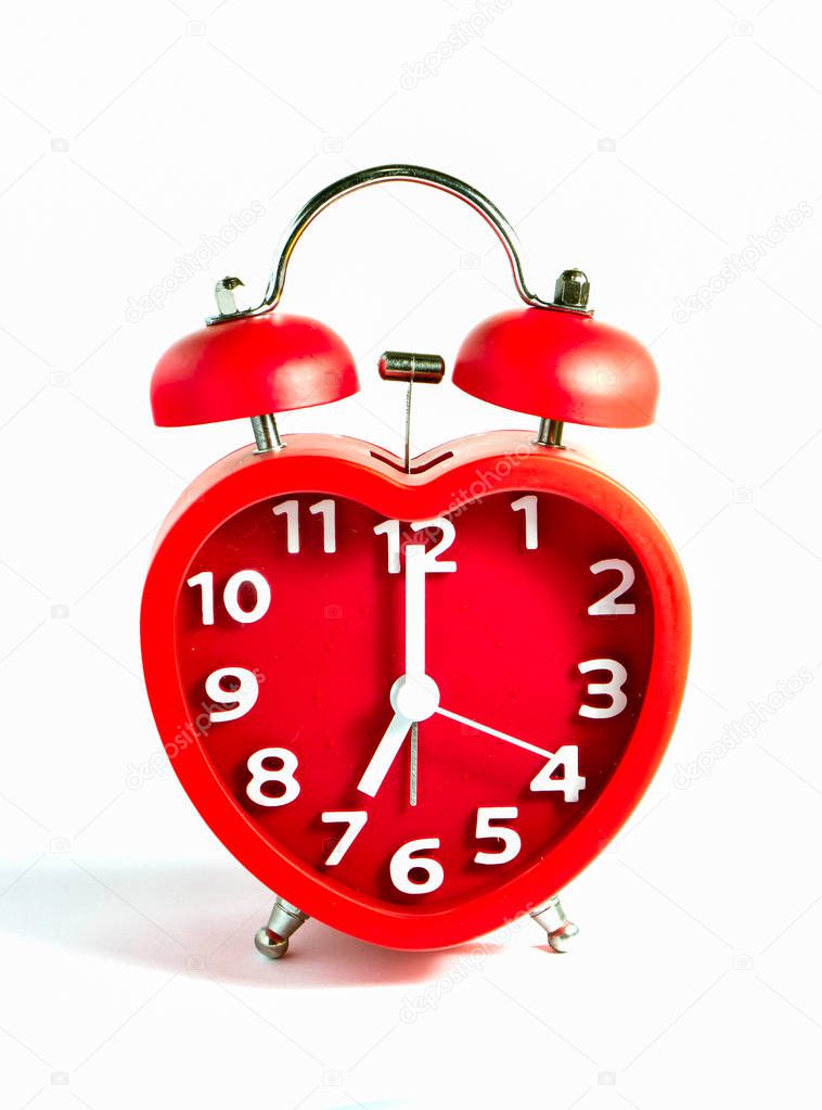 Red clock double bell mark at seven o'clock