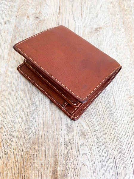 Brown leather luxury wallet put on wooden — Stock Photo, Image