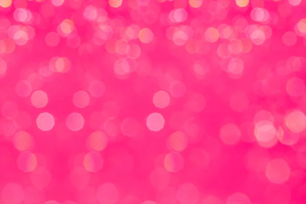 Bokeh glamour rosa bakgrund med suddiga rainbow lampor. — Stockfoto