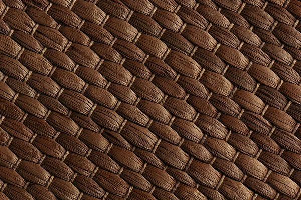Bambu tecido tapete marrom artesanal fundo . — Fotografia de Stock