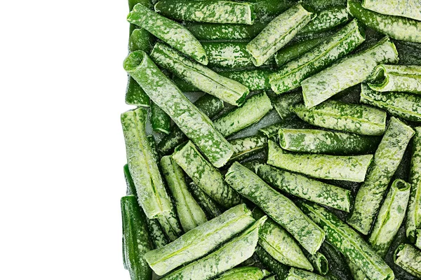 Border of fresh frozen green french bean with hoarfrost closeup on white background. — Stock Photo, Image