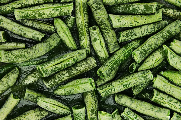 Fresh frozen green french bean with hoarfrost closeup as background. — Stock Photo, Image