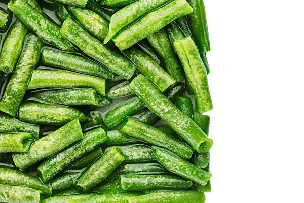 Border of wet fresh green french bean in water  closeup on white background. — Stock Photo, Image