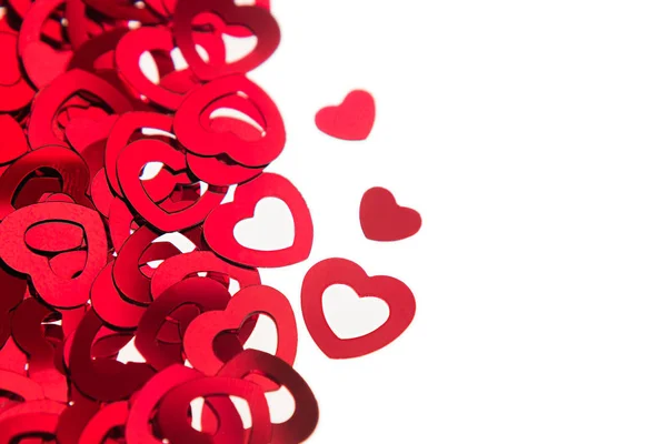 Valentines day border of red hearts confetti with copy space on white background. — Stock Photo, Image