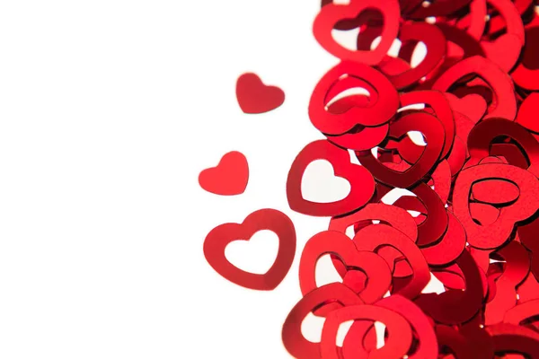 Valentines day border of red hearts confetti with copy space on white background. — Stock Photo, Image