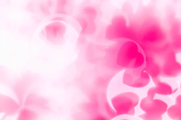 Día de San Valentín fondo abstracto de suave rosa, blanco bokeh desenfoque corazones . — Foto de Stock