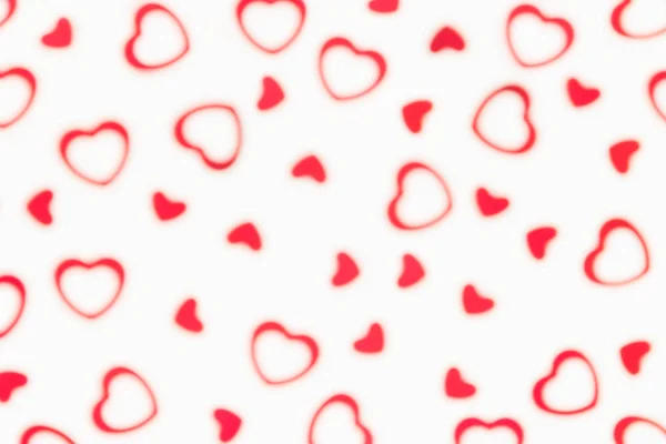 Aftelkalender voor Valentijnsdag decoratieve zachte vervaging abstracte patroon van rode harten confetti op witte achtergrond. — Stockfoto
