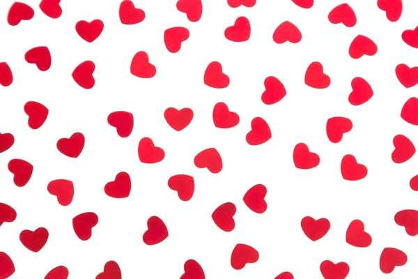 Día de San Valentín patrón decorativo corazones rojos confeti aislado sobre fondo blanco . —  Fotos de Stock