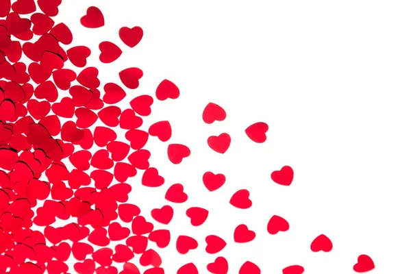 Día de San Valentín borde decorativo de corazones rojos confeti aislado sobre fondo blanco . —  Fotos de Stock