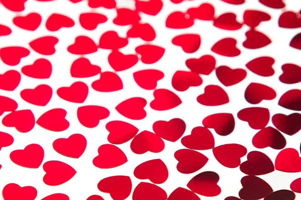 Valentines day pattern of red hearts confetti on white background. — Stock Photo, Image