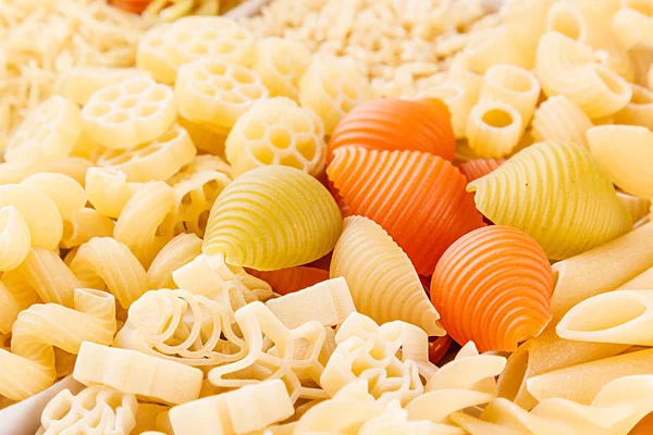 Pasta surtido de fondo de diferentes tipos de macarrones italianos primer plano . — Foto de Stock