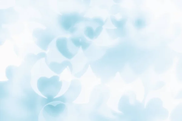 Αφηρημένα φόντο ημέρα του Αγίου Βαλεντίνου από απαλό μπλε, λευκό bokeh θαμπάδα καρδιές. — Φωτογραφία Αρχείου
