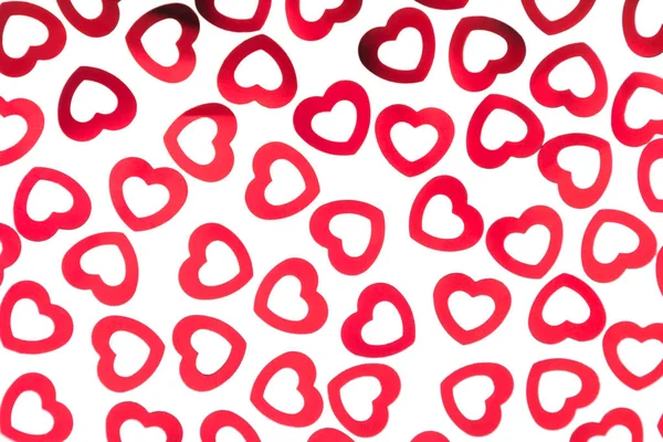 Día de San Valentín patrón decorativo corazones rojos confeti aislado sobre fondo blanco . —  Fotos de Stock