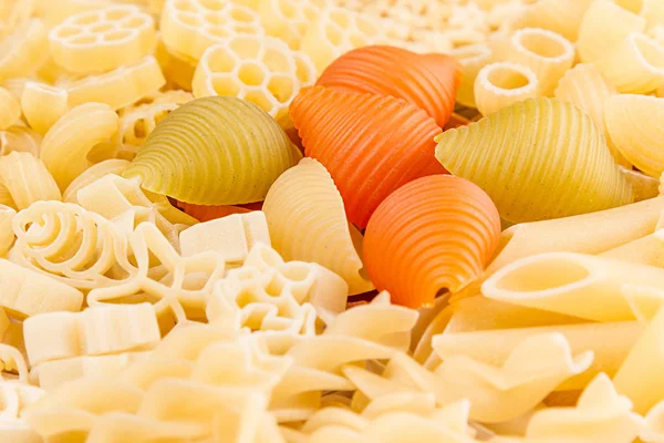 Pasta surtido de fondo de diferentes tipos de macarrones italianos primer plano . — Foto de Stock