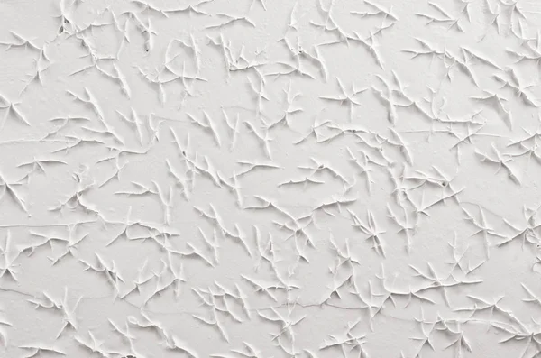 Biały tynk dekoracyjny streszczenie tekstura z pęknięcia, splash, ślady. — Zdjęcie stockowe