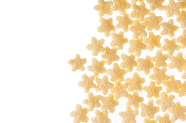 Dekorativa kantlinjer av gula stjärnor majsflingor isolerad på vit bakgrund. — Stockfoto