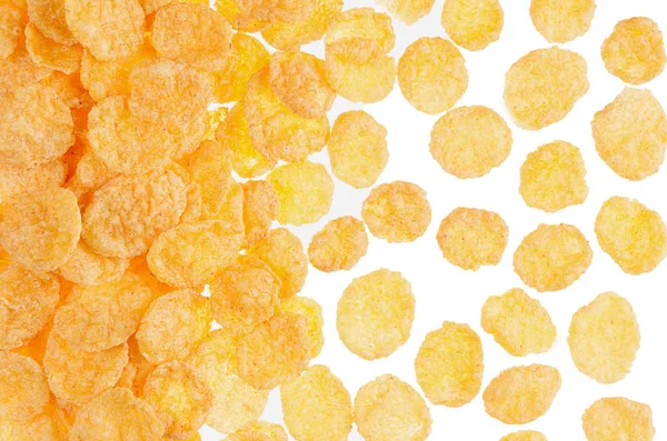 Corn flakes closeup pattern on white background, top view. Cereals texture. — Stock Photo, Image
