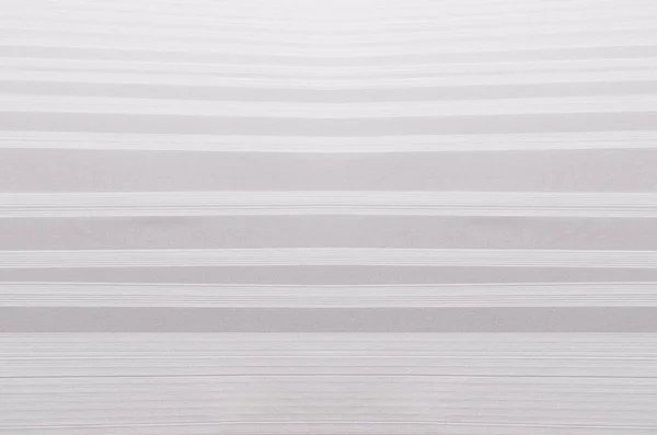Csíkos lépcsőzetes puha fehér és szürke absztrakt papír textúra félárnyék szemszögéből. — Stock Fotó