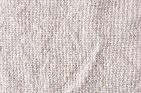 Beige canvas rough crumpled fabric texture. — Stock Photo, Image