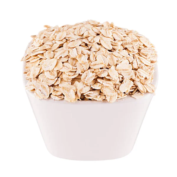 Oats-flake in white bowl, closeup, isolated. Template for menu, cover, advertising. — Stock Photo, Image