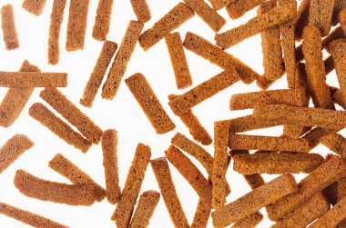 Rye croutons sticks on white background. Beer snacks texture. clipart