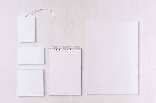 Branding business mock up of white blank stationery set on light soft white wooden background. Template for branding, business presentations and portfolios.