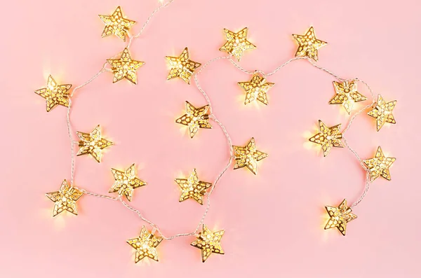 Christmas Lights Golden Stars Glowing Soft Light Pastel Pink Background — Stock Photo, Image
