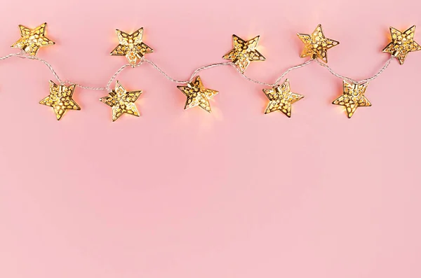 Festive Bright Background Gold Star Lights Garland Pastel Pink Color — Stock Photo, Image