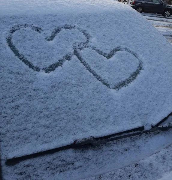 Good view in first days of new year two hearts in snow car.