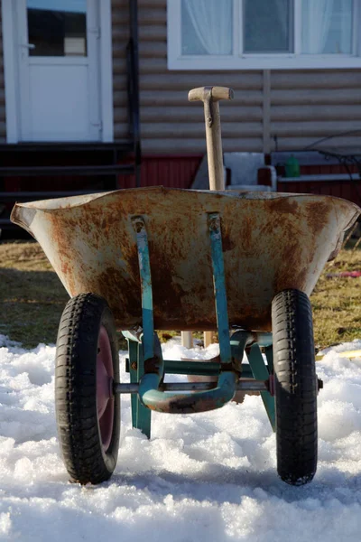 garden car in the country. the snow is melting and spring is coming. sunny spring day. close up.