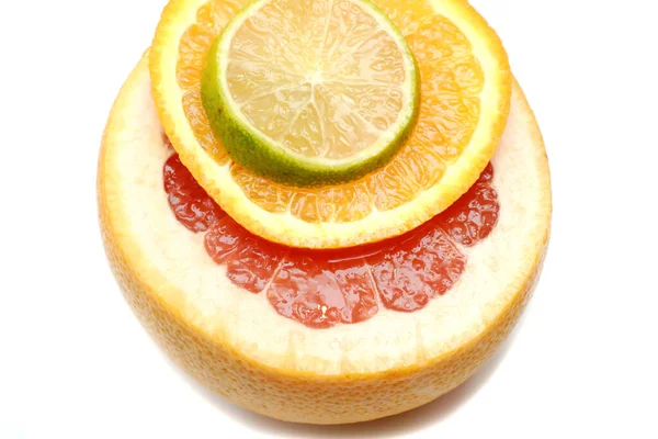 Slices of grapefruit, orange, and lime — Stock Photo, Image