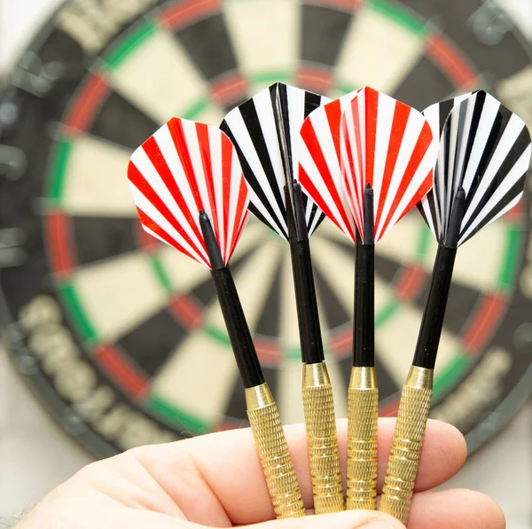 Player Holds Darts His Palm Ready Throw Dart Board Background — Stock Photo, Image