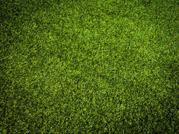 Yeşil çim futbol sahası arka planının yakın görüntüsü. Çalışma ve tasarım için duvar kağıdı.