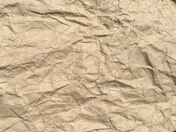 棕色皱折的纸张背景与副本空间的设计 湿透的墙纸图案 — 图库照片