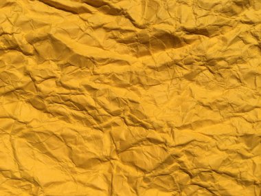 Tasarım için sarı buruşuk kağıt arka plan. Metin veya çalışma için boşluk kopyala 
