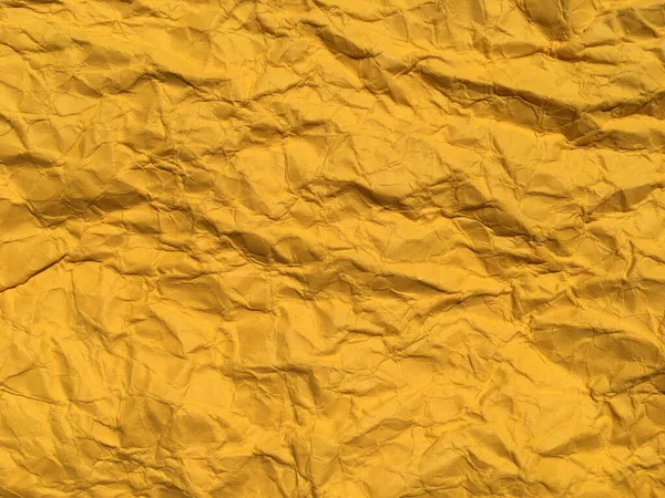Yellow wrinkled paper background for Design. Copy space for text or work 