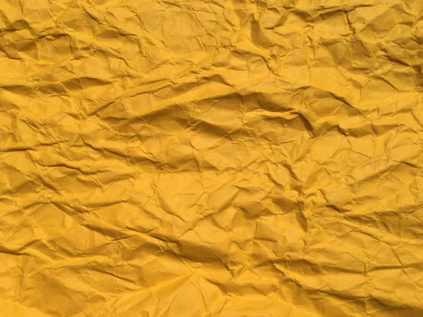 デザインのための黄色のしわ紙の背景の抽象的なテクスチャ テキストまたは作業用のスペースのコピー — ストック写真