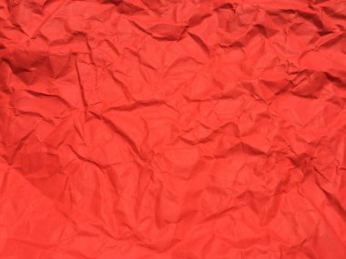 Tasarım için kırmızı buruşmuş kağıt dokusu arka planı. Kopyalama alanı için duvar kağıdı