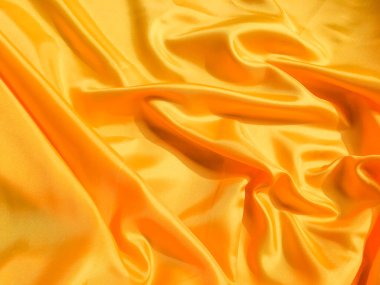 Tasarım için kopyalama alanı olan sarı ipek ya da saten doku arkaplanı