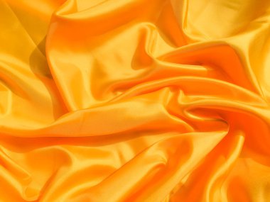 Tasarım için kopyalama alanı olan sarı ipek ya da saten doku arkaplanı