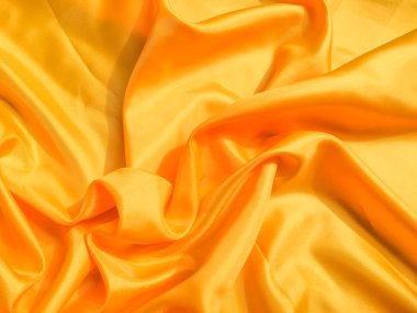 Tasarım için kopyalama alanı olan sarı ipek ya da saten doku arkaplanı