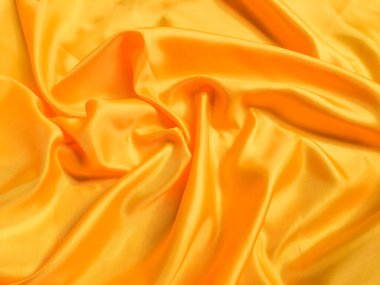 Tasarım için kopyalama alanı olan sarı ipek ya da saten doku arkaplanı