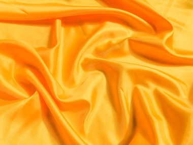 Asgari sarı kumaş dokusu arka planı. pürüzsüz dalgalı ışık ile cpoy boşluk