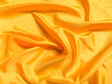 Asgari sarı kumaş dokusu arka planı. pürüzsüz dalgalı ışık ile cpoy boşluk