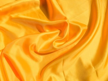 Asgari sarı kumaş dokusu arka planı. pürüzsüz dalgalı ışık ile cpoy boşluk