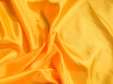 Asgari sarı kumaş dokusu arka planı. pürüzsüz dalgalı ışık ile cpoy boşluk