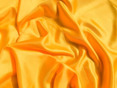 Asgari sarı kumaş dokusu arka planı. pürüzsüz dalgalı ışık ile cpoy boşluk